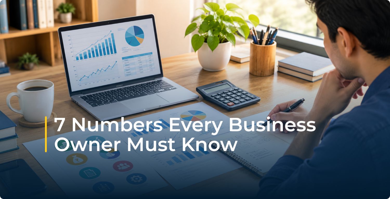 Business owner reviews charts on a laptop with calculator and notes at a desk; overlay reads “7 Numbers Every Business Owner Must Know,” conveying focus.